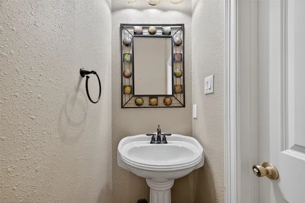a view of a livingroom with a ceiling fan and window