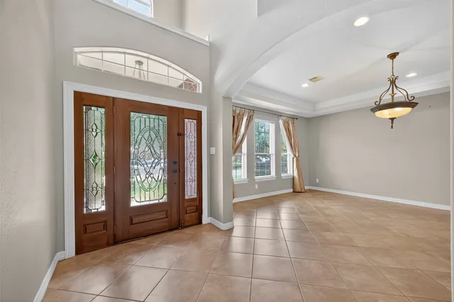 a view of an empty room with glass door
