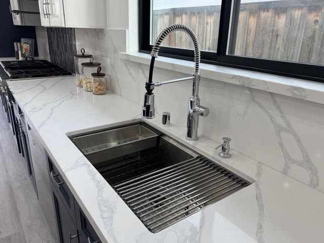 a close view of sink and washing machine