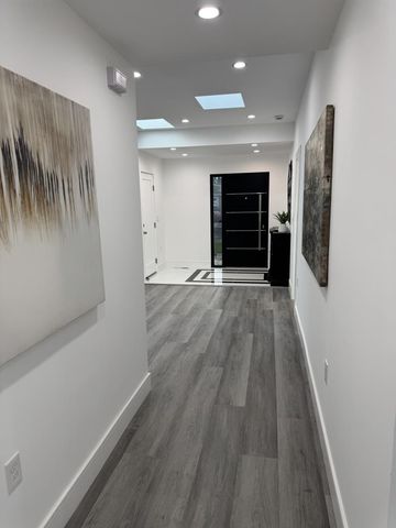 wooden floor in an empty room with a fireplace
