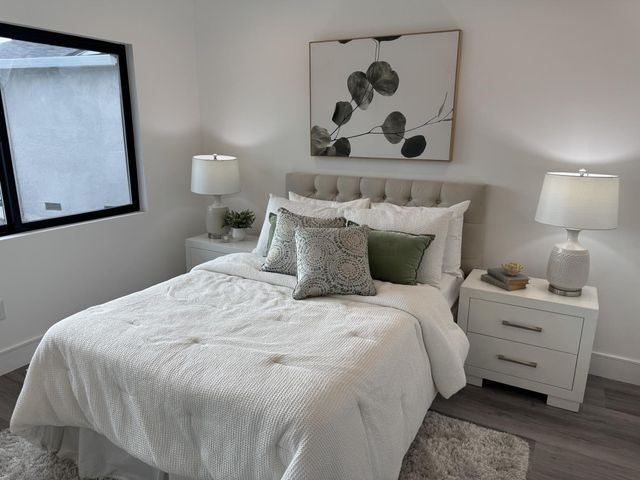 a bedroom with a bed and walk in closet