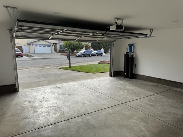 a view of a backyard with sitting area