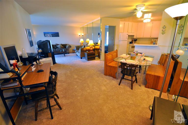 2901 Peninsula Road, Unit 331 Oxnard, CA 93035 - Photo 2 of 21 a dining room with furniture and a chandelier