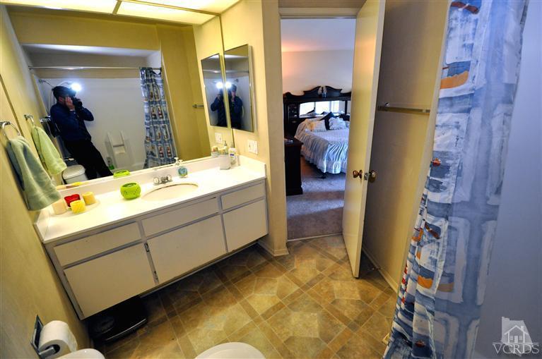 2901 Peninsula Road, Unit 331 Oxnard, CA 93035 - Photo 11 of 21 a bathroom with a sink vanity and mirror