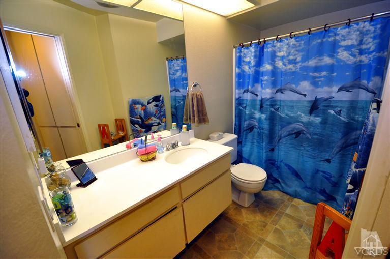 2901 Peninsula Road, Unit 331 Oxnard, CA 93035 - Photo 12 of 21 a bathroom with a sink and a mirror