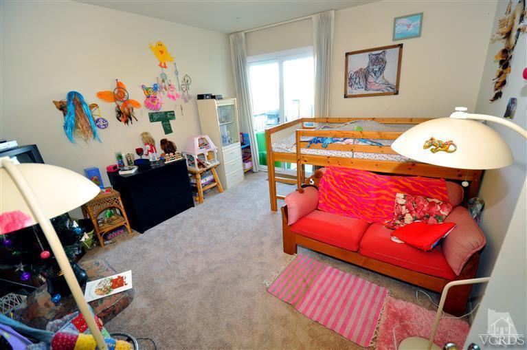 2901 Peninsula Road, Unit 331 Oxnard, CA 93035 - Photo 13 of 21 a bedroom with a bed and furniture