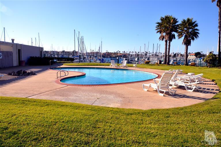 2901 Peninsula Road, Unit 331 Oxnard, CA 93035 - Photo 17 of 21 a view of a swimming pool with outdoor seating