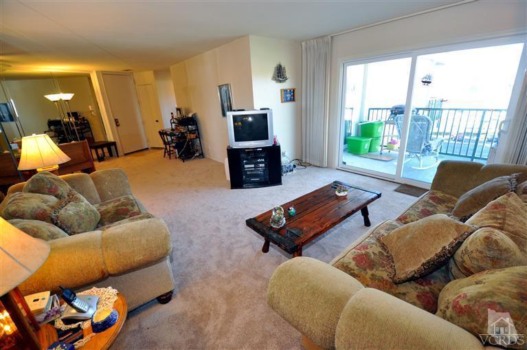 2901 Peninsula Road, Unit 331 Oxnard, CA 93035 - Photo 8 of 21 a living room with furniture and a window