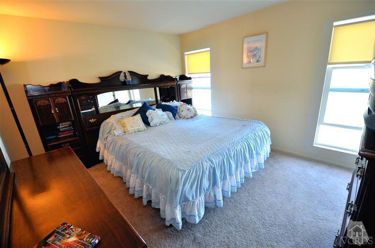 2901 Peninsula Road, Unit 331 Oxnard, CA 93035 - Photo 9 of 21 a bedroom with a bed and a window
