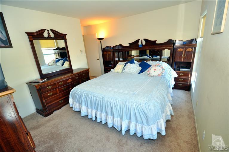 2901 Peninsula Road, Unit 331 Oxnard, CA 93035 - Photo 10 of 21 a bed sitting in a bedroom next to a window with pc on dresser