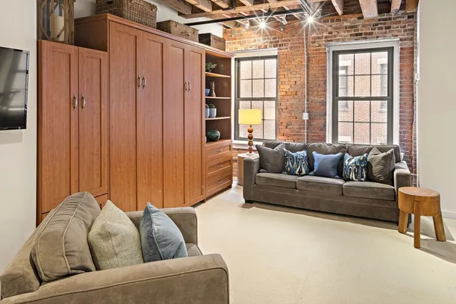 a living room with furniture and windows