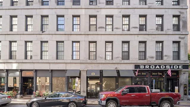 a view of a car parked in front of building