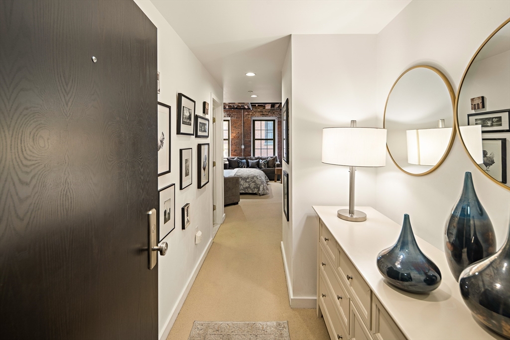 99-105 Broad Street, Unit 4F Boston, MA 02110 - Photo 2 of 16 a view of living room and workspace