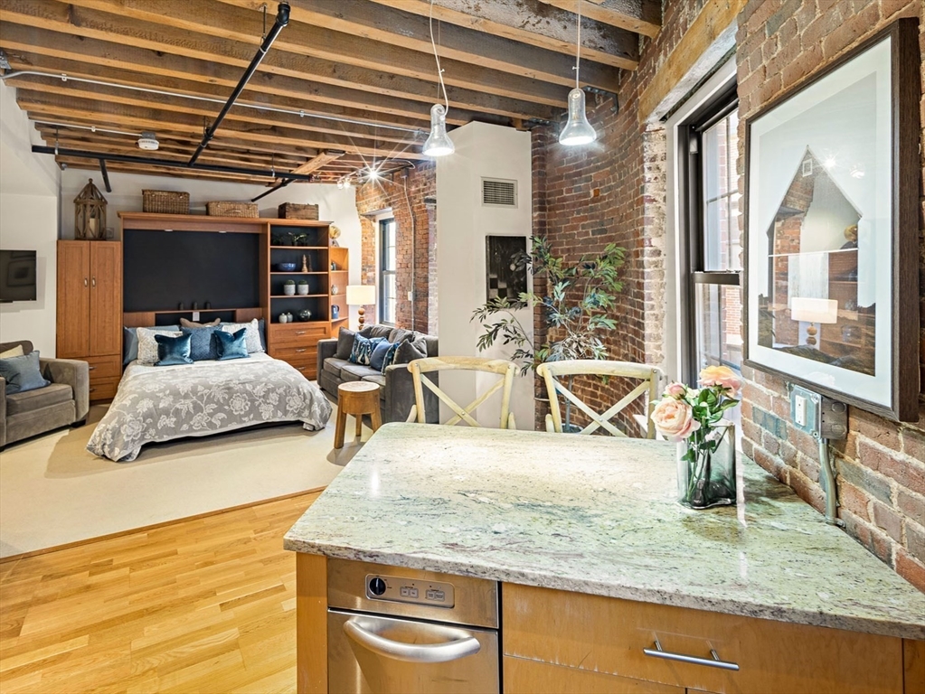 99-105 Broad Street, Unit 4F Boston, MA 02110 - Photo 5 of 16 a view of living room with furniture and flat screen tv
