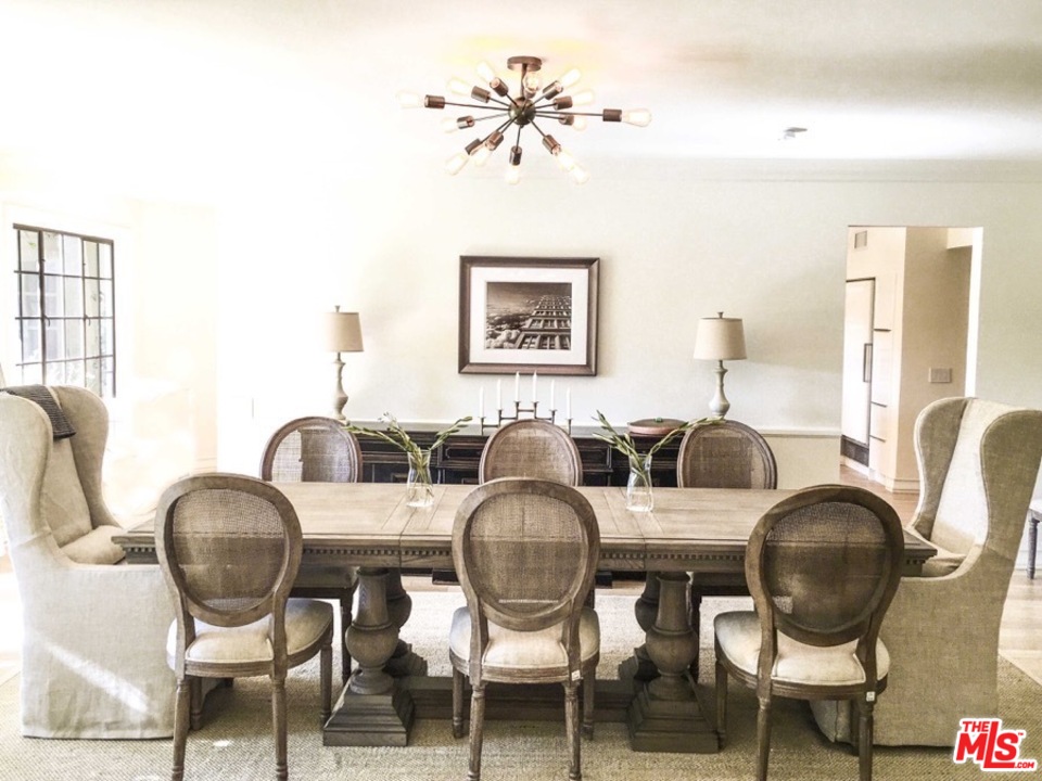1075 Wallace Ridge Beverly Hills, CA 90210 - Photo 11 of 35 a living room with couches chairs and chandelier