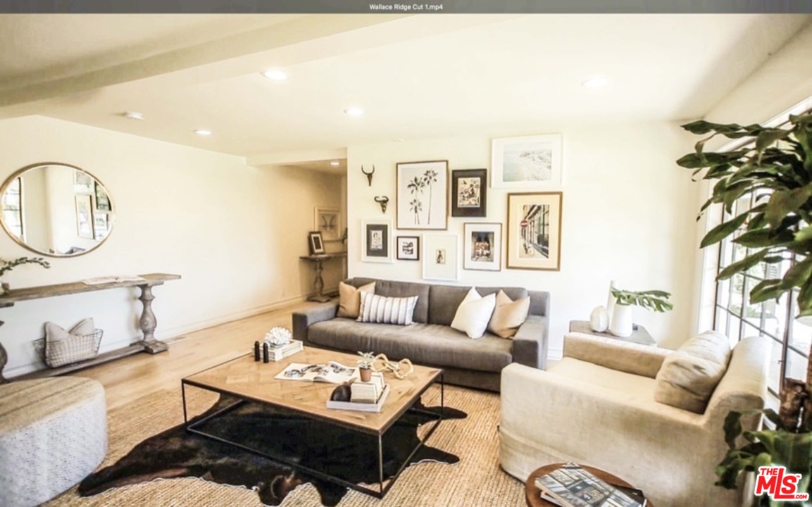 1075 Wallace Ridge Beverly Hills, CA 90210 - Photo 15 of 35 a living room with furniture a rug and a potted plant