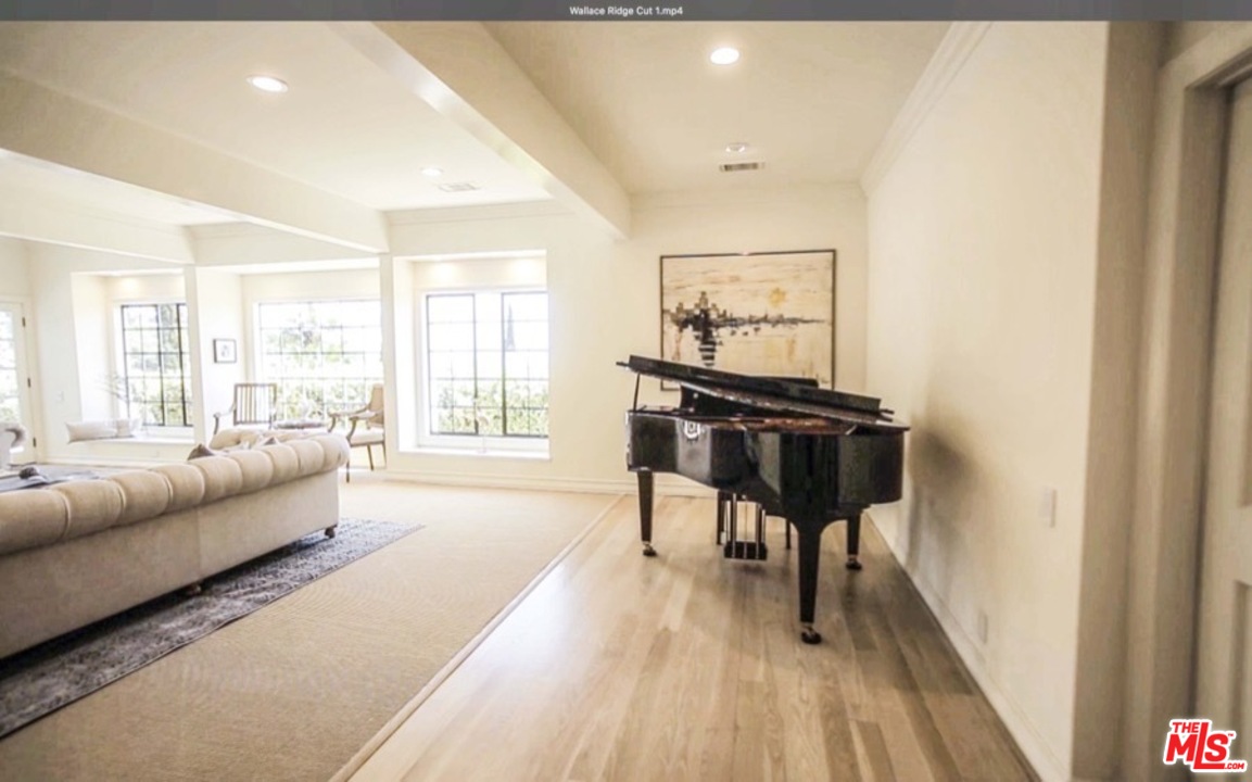 1075 Wallace Ridge Beverly Hills, CA 90210 - Photo 17 of 35 a living room with furniture and a large window