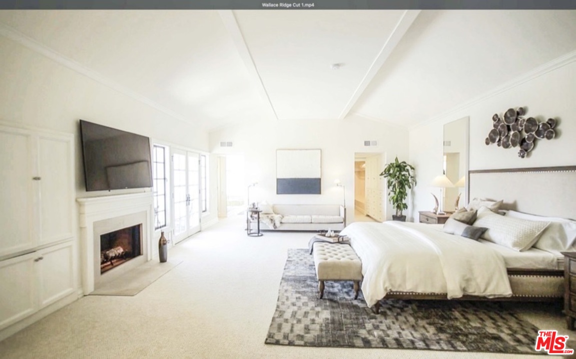 1075 Wallace Ridge Beverly Hills, CA 90210 - Photo 18 of 35 a living room with furniture fireplace and flat screen tv