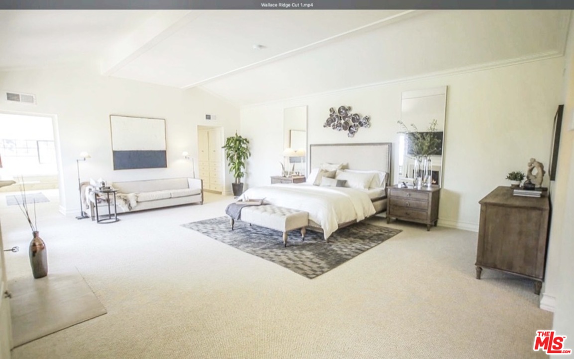 1075 Wallace Ridge Beverly Hills, CA 90210 - Photo 19 of 35 a spacious bedroom with a bed a couch and dresser