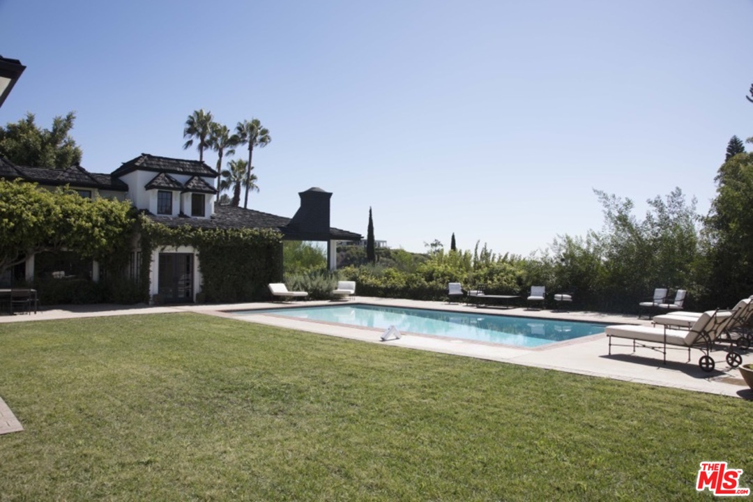 1075 Wallace Ridge Beverly Hills, CA 90210 - Photo 2 of 35 a view of a house with pool and a yard