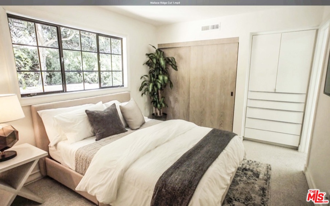 1075 Wallace Ridge Beverly Hills, CA 90210 - Photo 24 of 35 a bedroom with a bed and a window