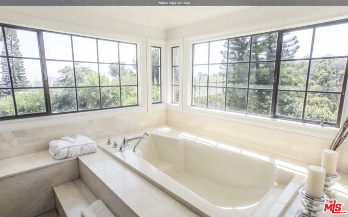 1075 Wallace Ridge Beverly Hills, CA 90210 - Photo 25 of 35 a bathroom with a bathtub and window