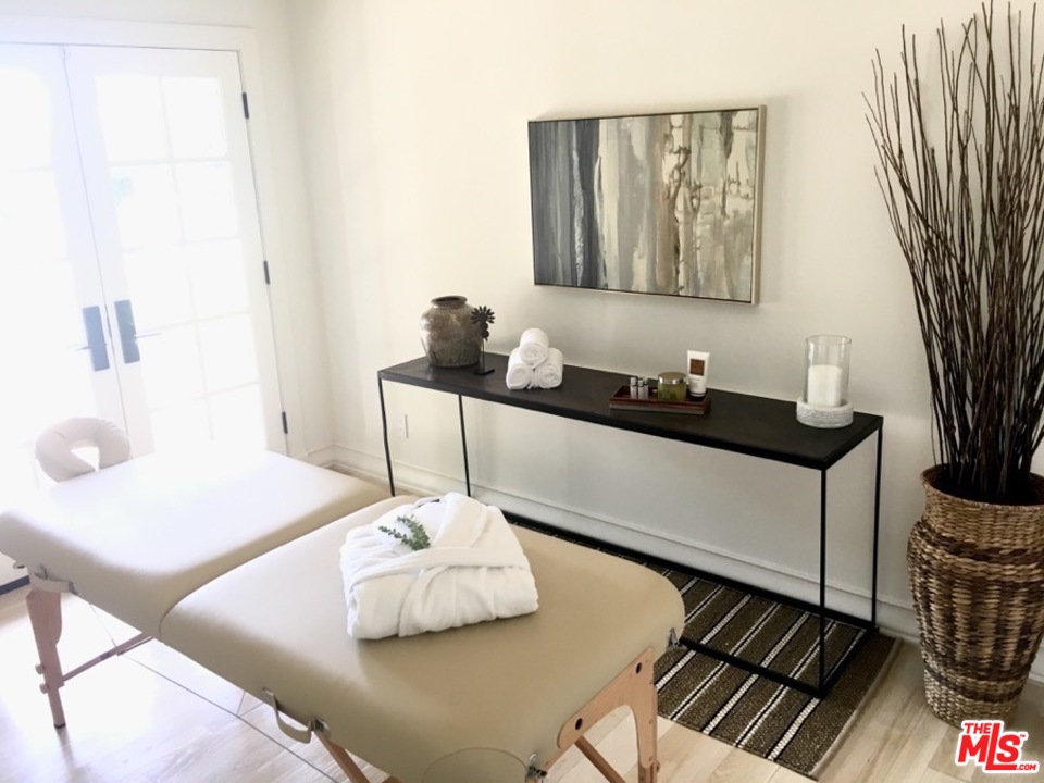 1075 Wallace Ridge Beverly Hills, CA 90210 - Photo 30 of 35 a bathroom with a sink and a mirror