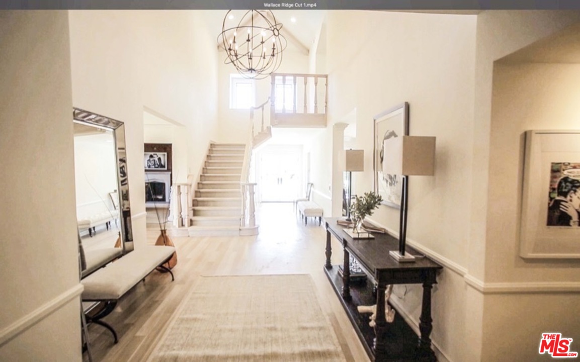 1075 Wallace Ridge Beverly Hills, CA 90210 - Photo 4 of 35 a living room with furniture and a wooden floor