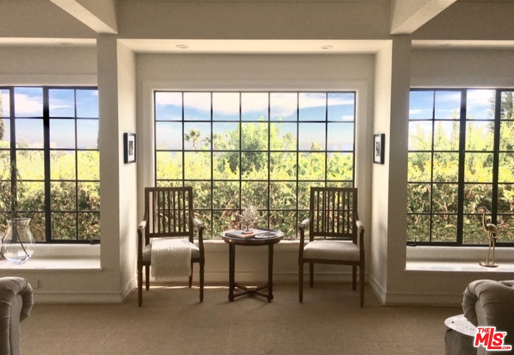 1075 Wallace Ridge Beverly Hills, CA 90210 - Photo 7 of 35 a living room with furniture and a floor to ceiling window