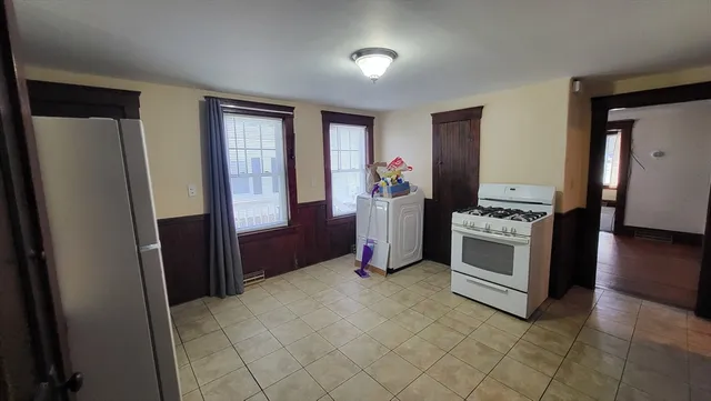 a kitchen with stainless steel appliances a refrigerator sink and stove
