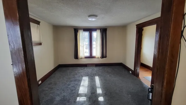 a view of hallway with windows