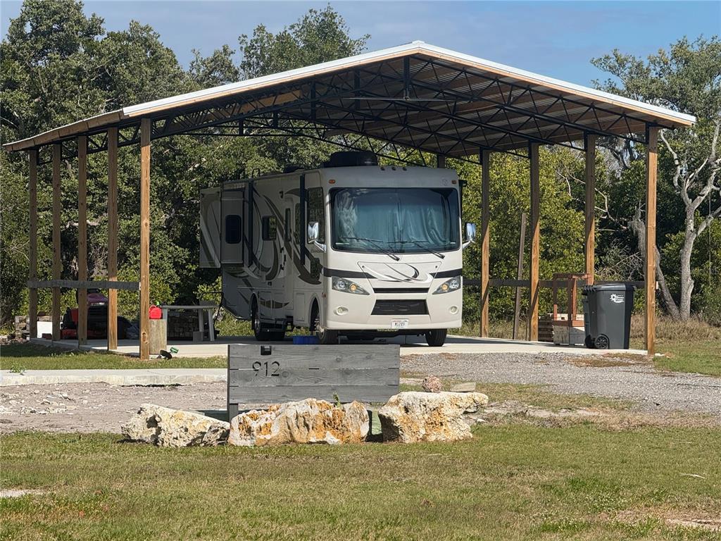 912 Piney Point Road Palmetto, FL 34221 - Photo 2 of 10 a view of a house with backyard porch and sitting area