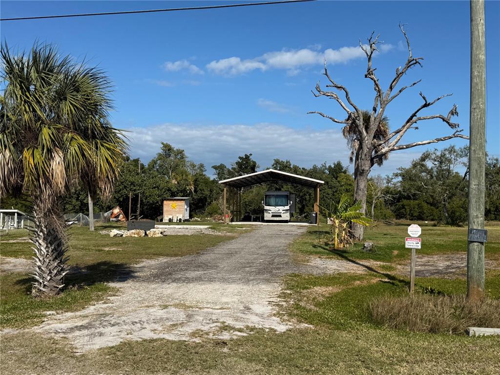 912 Piney Point Road Palmetto, FL 34221 - Photo 5 of 10 a view of a house with a yard