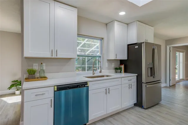 an empty room with wooden floor and a window