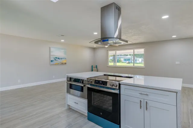 a kitchen with stainless steel appliances a refrigerator and a sink