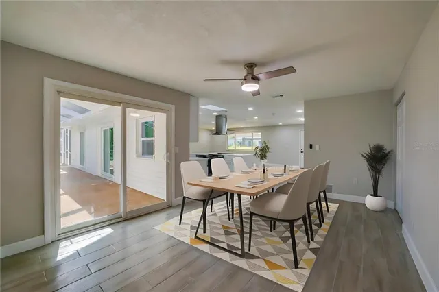 an empty room with windows and a fireplace