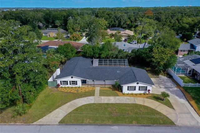 an aerial view of a house with a garden