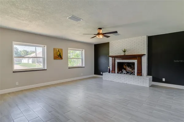 a bedroom with a large bed and a large window