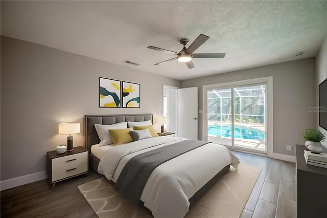 an empty room with wooden floor and ceiling fan