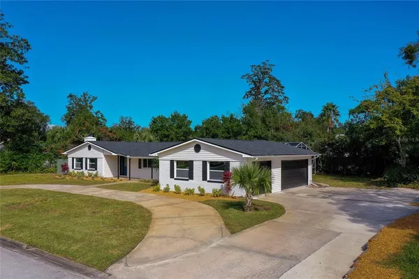 a view of house with yard outdoor seating and entertaining space
