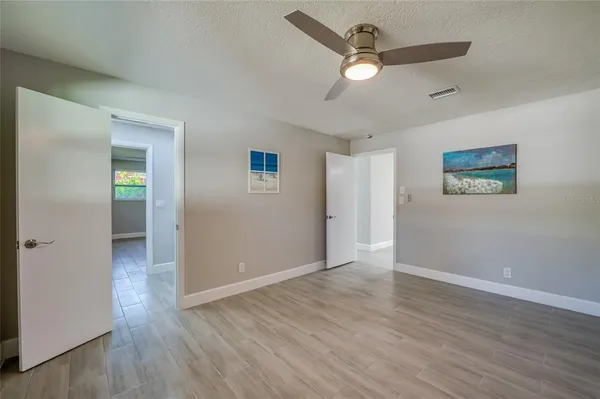 a white toilet sitting next to a bathroom sink and shower