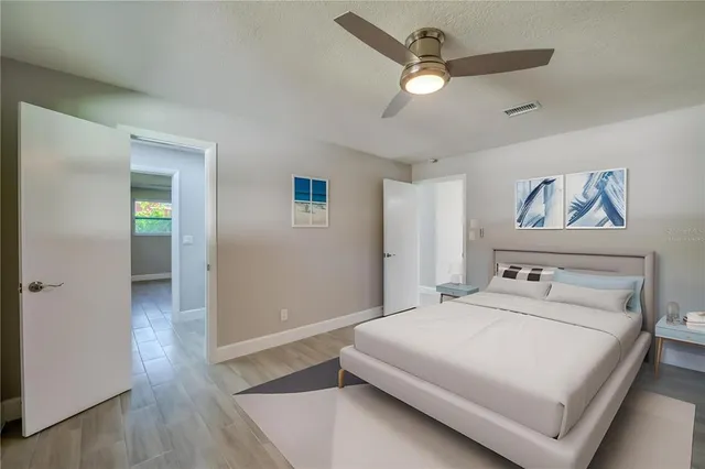 a white toilet sitting next to a bathroom sink and shower