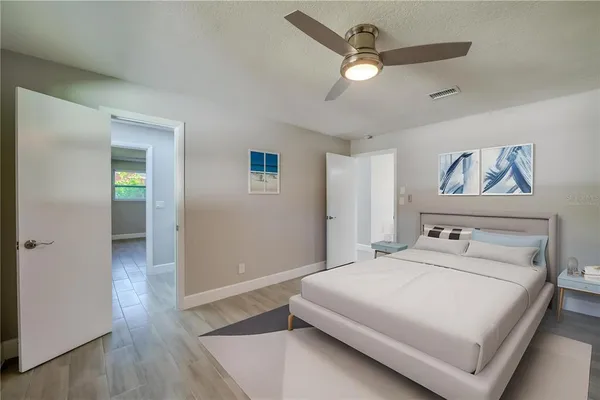 a spacious bathroom with a double vanity sink and mirror