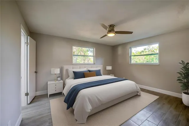 a bedroom with a large bed and a window
