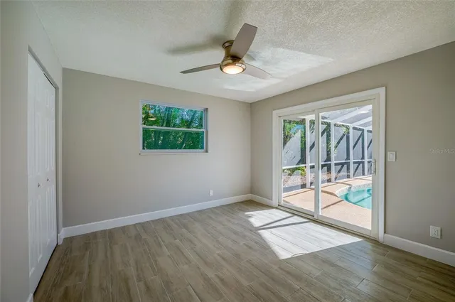 a spacious bathroom with a double vanity sink a toilet and a mirror