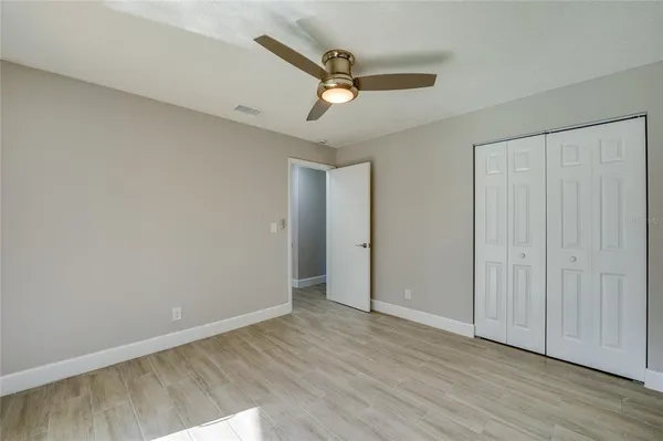 a view of a house with backyard sitting area and tub