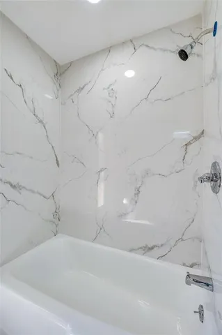 a backyard of a house with plants and tree