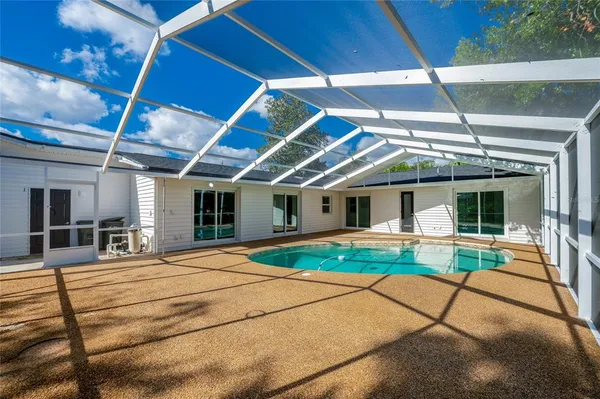 an aerial view of a house with a garden and plants
