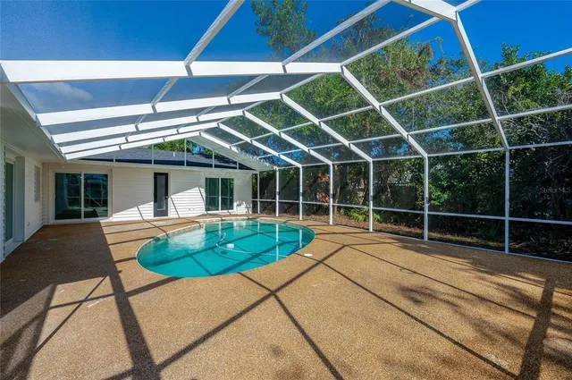 an aerial view of a house with a garden and plants