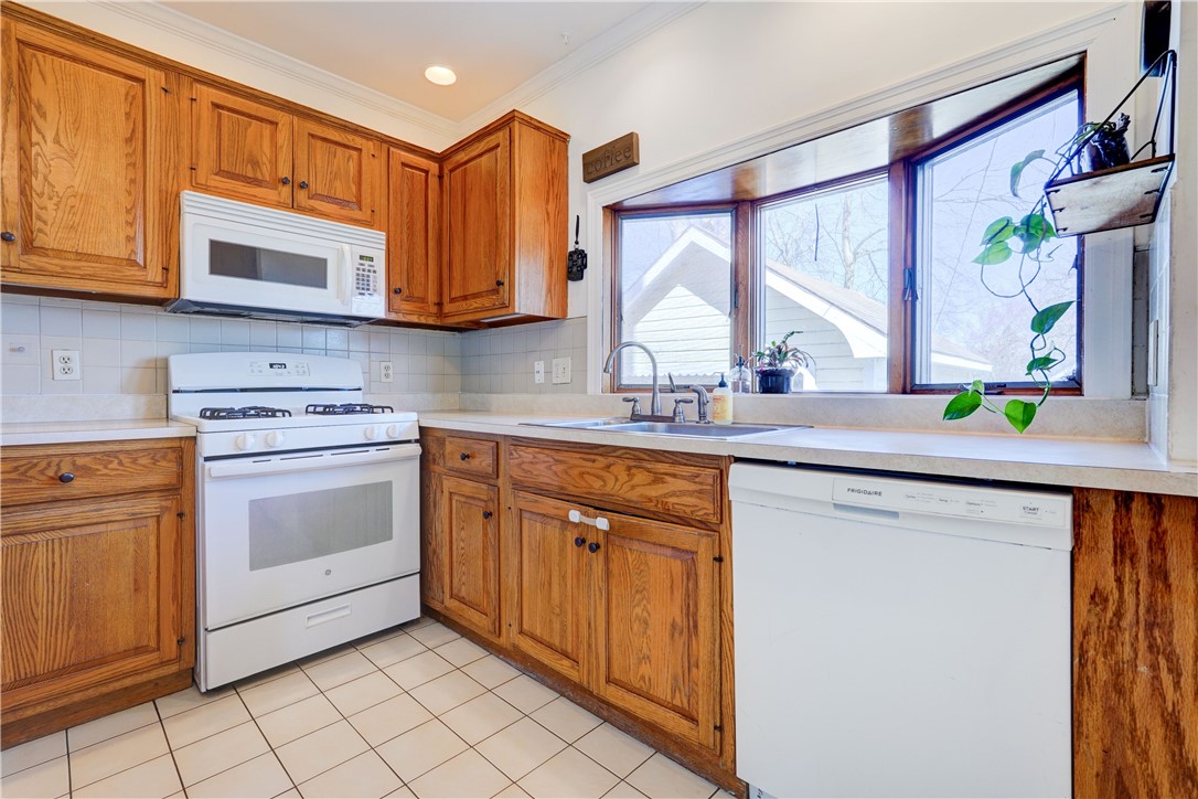 134 Wyndham Road Rochester, NY 14612 - Photo 12 of 31 Garden window in the kitchen with a a view to the